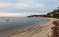 An unidentified man fishes in Nelson Bay.